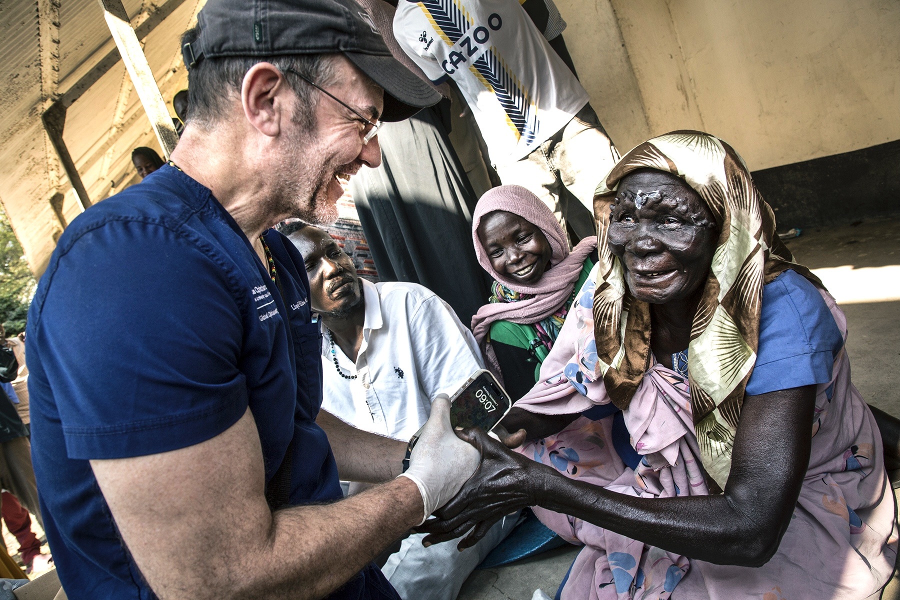 Chris Hildreth photograph of blind patients with Dr. Lloyd Williams at surgical outreach in South Sudan