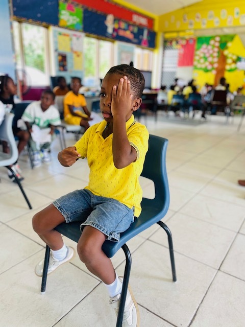 Child completing eye screening in Antigua and Barbuda
